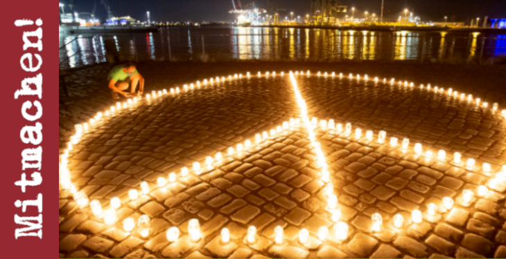 Licht im Dunkeln - Peace-Zeichen aus Kerzen